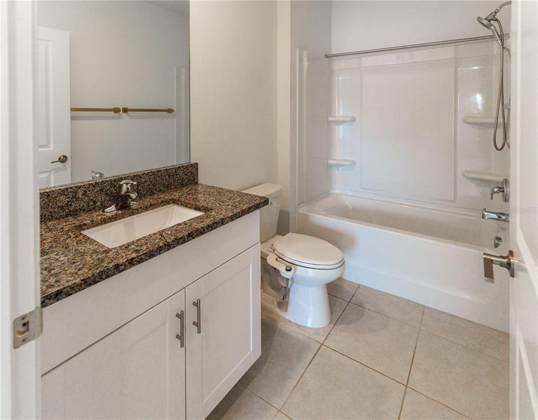 Furnished interior view inside a new home in The Isle of Avalon, Spring Hill (Image 10).
