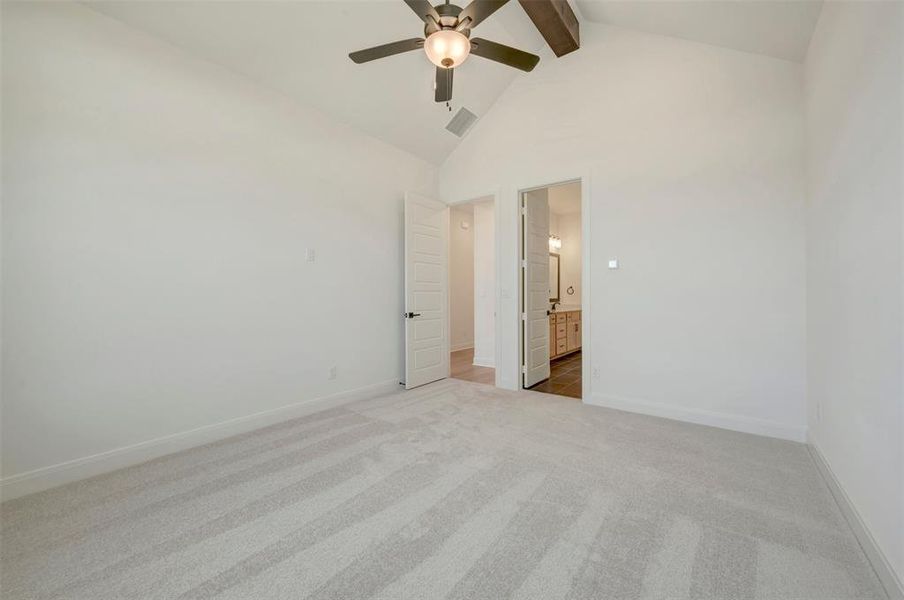 Vaulted ceiling featuring a ceiling fan with light fixture Vaulted ceiling featuring a ceiling fan with light fixture