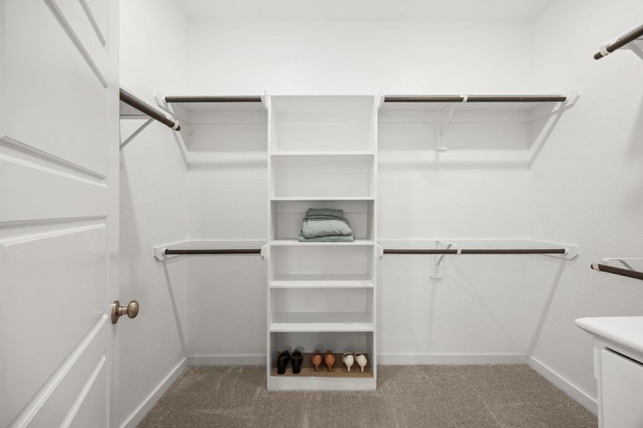 Stay organized with the primary walk-in closet. With built-in shelves and multiple rods for hanging clothes, you'll have a place for everything!