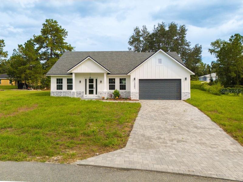 Front exterior of a new home in , Ocala, FL, highlighting curb appeal (Image 21).