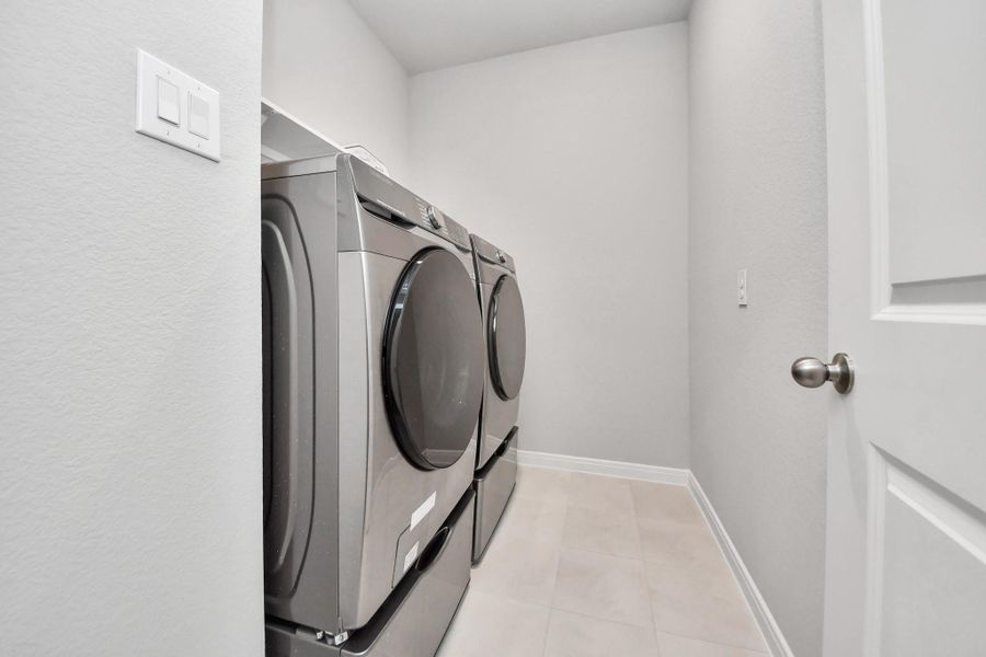 Inside Laundry room.  Washer and Dryer stay with the home.