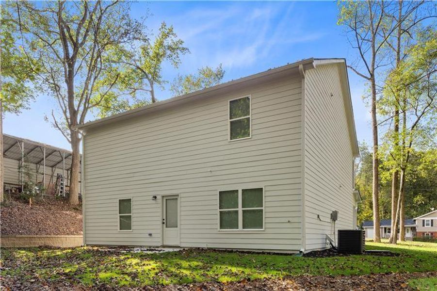 Exterior details and patio area of a home in , Buford (Image 24).