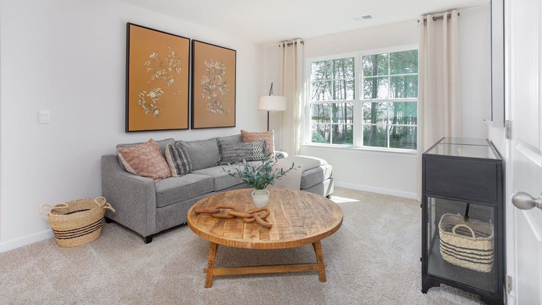 Representative furnished interior of a home built from the HAYDEN by D.R. Horton in River's Edge, Mayodan (Image 29).