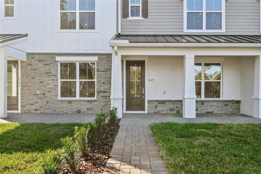 Exterior details and patio area of a home in Townes at Northlake, Oviedo (Image 3). Exterior details and patio area of a home in Townes at Northlake, Oviedo (Image 3).