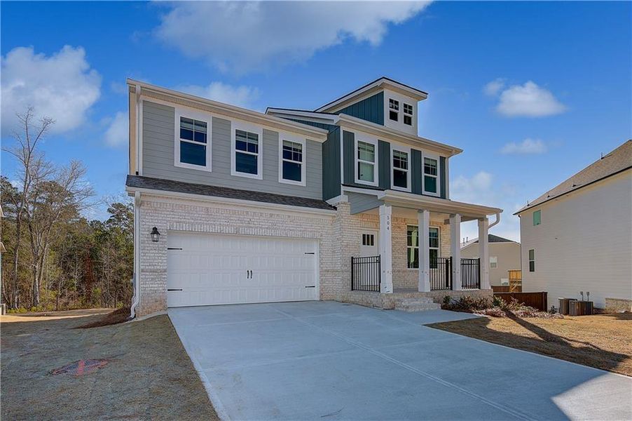 Front exterior of a new home in Kingston, Locust Grove, GA, highlighting curb appeal (Image 16).