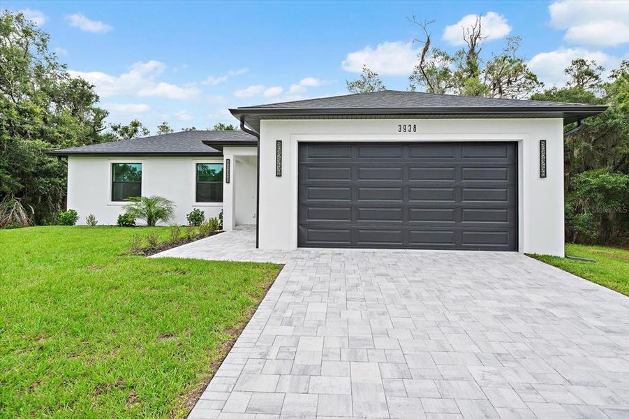 Front exterior of a new home in , North Port, FL, highlighting curb appeal (Image 21).