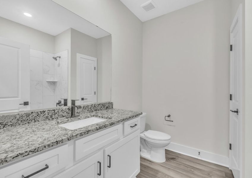 The secondary bathroom comes with a large soaking tub. The secondary bathroom comes with a large soaking tub.