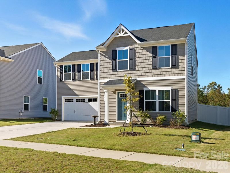 Front exterior of a new home in , Troutman, NC, highlighting curb appeal (Image 2). Front exterior of a new home in , Troutman, NC, highlighting curb appeal (Image 2).
