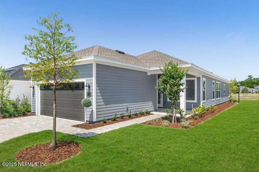 Front exterior of a new home in Brookside at Shearwater, St. Augustine, FL, highlighting curb appeal (Image 17). Front exterior of a new home in Brookside at Shearwater, St. Augustine, FL, highlighting curb appeal (Image 17).