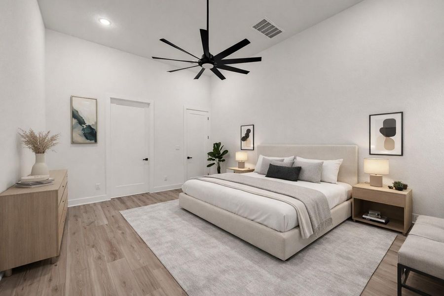 Virtually staged primary bedroom features luxury engineered flooring, en-suite bath, large ceiling fan and much more Virtually staged primary bedroom features luxury engineered flooring, en-suite bath, large ceiling fan and much more