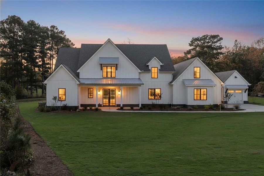 Front exterior of a new home in , Woodstock, GA, highlighting curb appeal (Image 2).