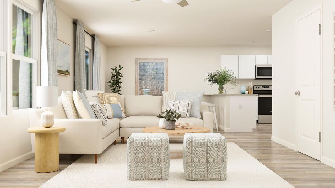 A living room with white furniture.