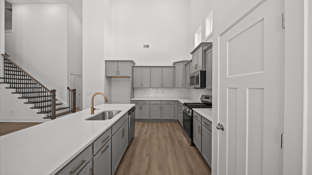 Vibrant and open kitchen centered around an 8-foot island