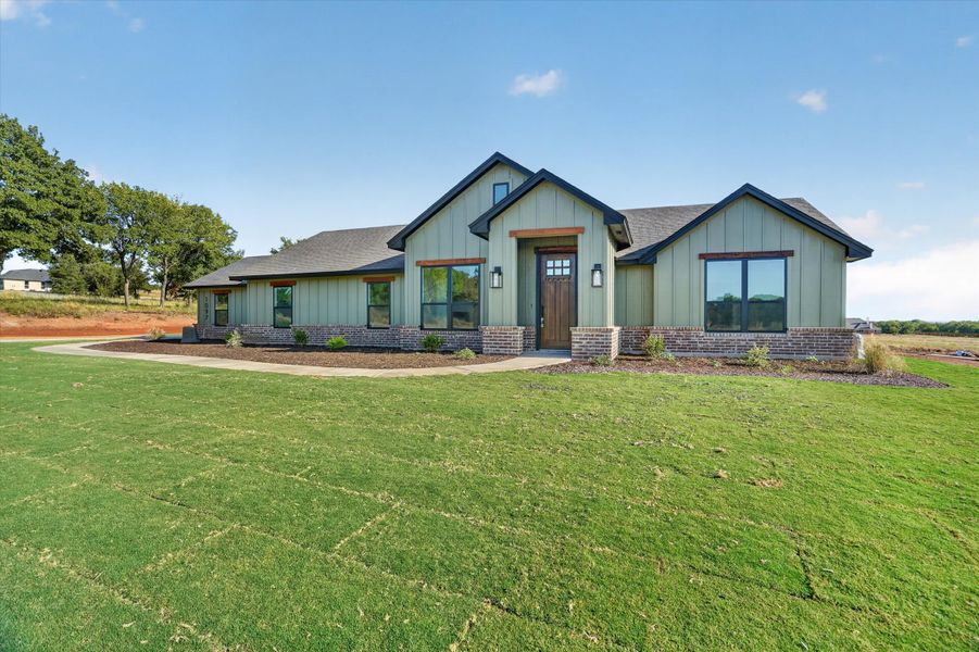 Front exterior of a new home in Taylor Ranch, Springtown, TX, highlighting curb appeal (Image 21).