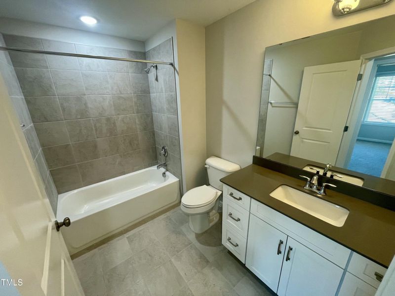 12.upper.level.hall.bath.tub with tile w