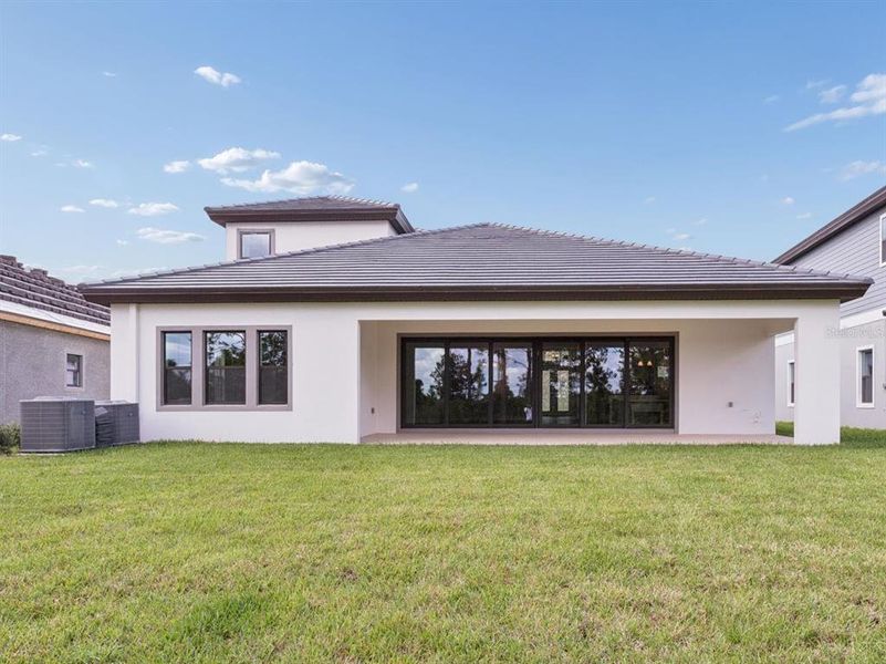 Exterior details and patio area of a home in Two Rivers, Zephyrhills (Image 17).