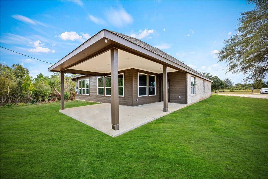 Exterior details and patio area of a home in , Prairie View (Image 17). Exterior details and patio area of a home in , Prairie View (Image 17).