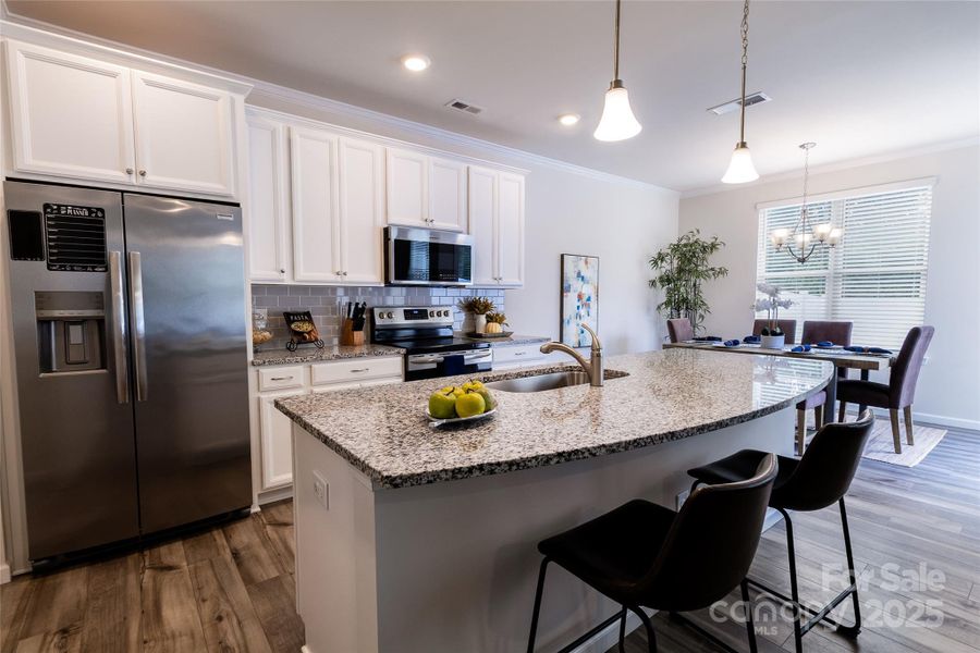 Beautiful white kitchen with stainless appliances