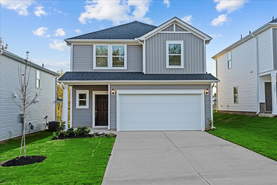 Front exterior of a new home in The Farm at Wells Creek - Heritage Collection, Gray Court, SC, highlighting curb appeal (Image 1). Front exterior of a new home in The Farm at Wells Creek - Heritage Collection, Gray Court, SC, highlighting curb appeal (Image 1).