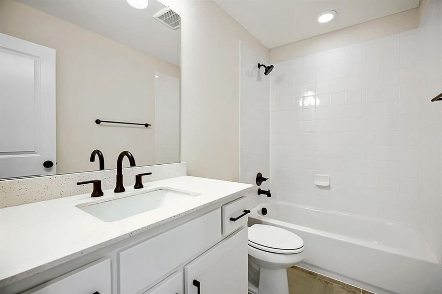 Full bathroom with vanity, bathing tub / shower combination, and recessed lighting Full bathroom with vanity, bathing tub / shower combination, and recessed lighting