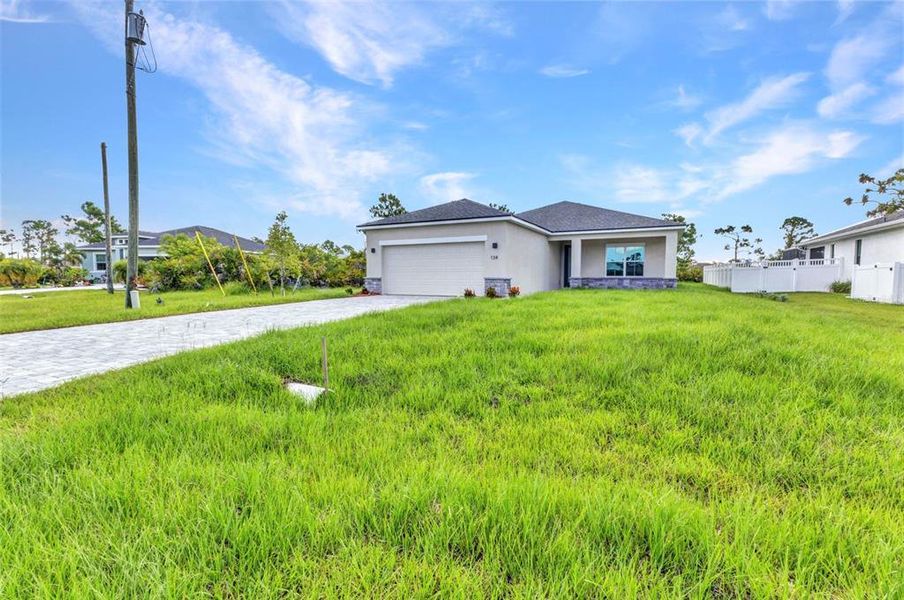 Front exterior of a new home in , Rotonda West, FL, highlighting curb appeal (Image 26). Front exterior of a new home in , Rotonda West, FL, highlighting curb appeal (Image 26).