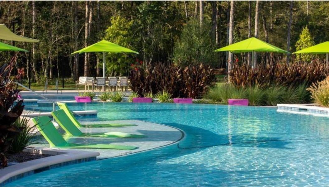 A massive, sparkling blue pool serves as the community’s center for relaxation. Featuring a beach-entry (zero- entry) design, dedicated lap lanes, and plenty of room for lounging, it offers a true vacation-at-home feel.