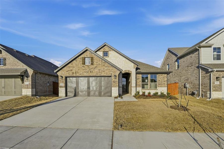 Front exterior of a new home in Morningstar, Aledo, TX, highlighting curb appeal (Image 22).