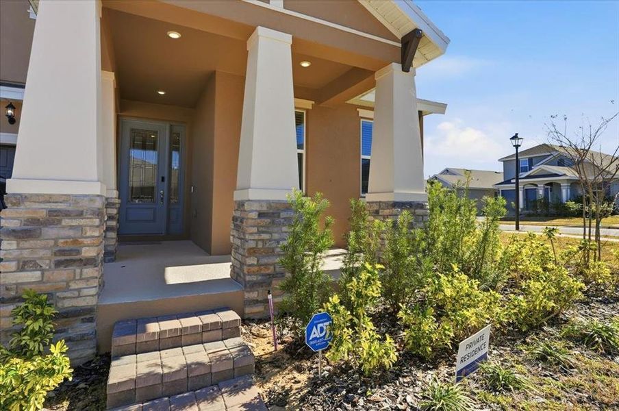 Exterior details and patio area of a home in Hills of Minneola, Minneola (Image 33).