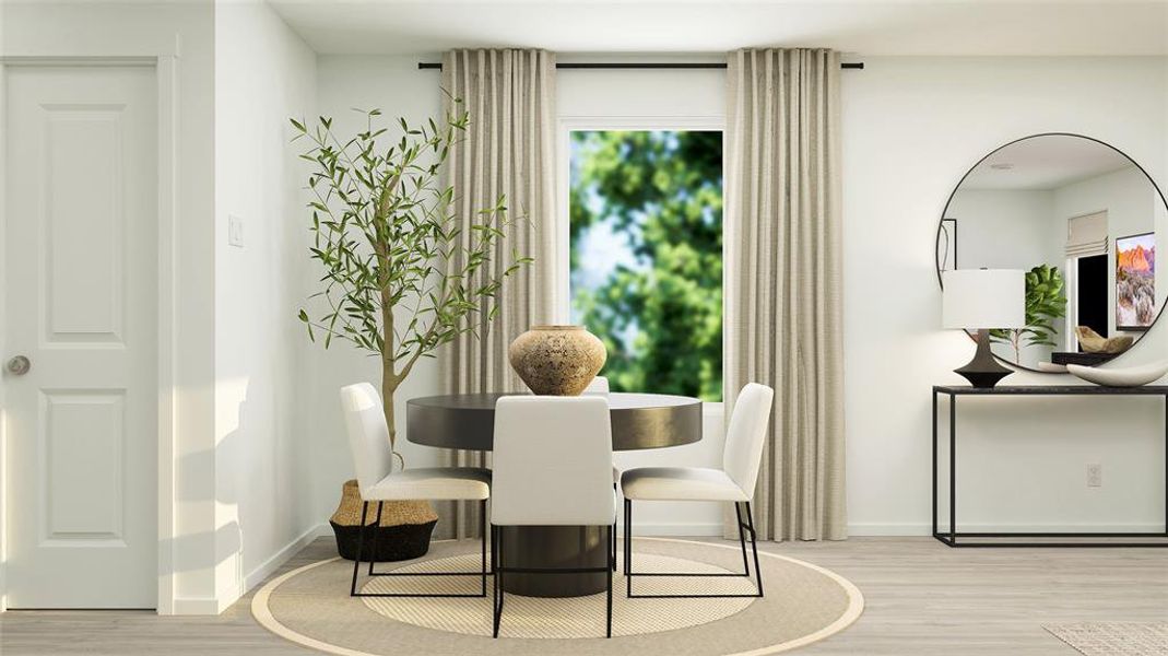 Dining space with light hardwood / wood-style floors