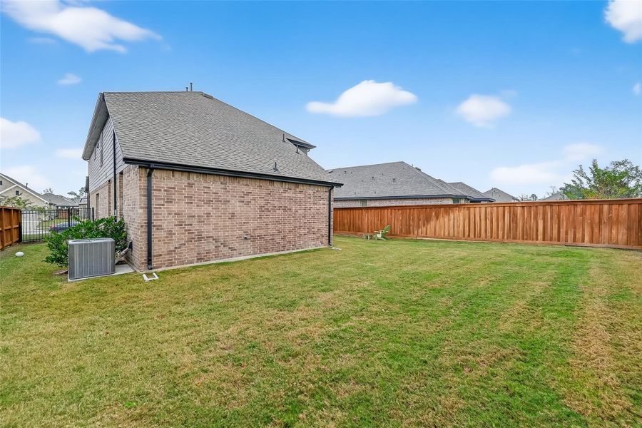 Exterior details and patio area of a home in NorthGrove, Magnolia (Image 25).