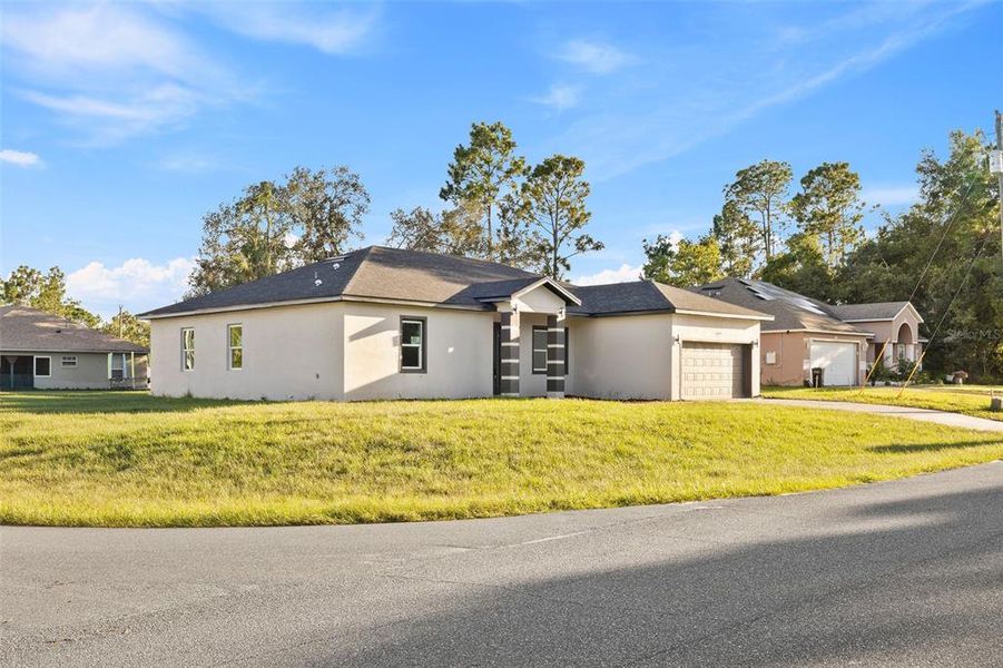 Front exterior of a new home in , Ocala, FL, highlighting curb appeal (Image 21). Front exterior of a new home in , Ocala, FL, highlighting curb appeal (Image 21).
