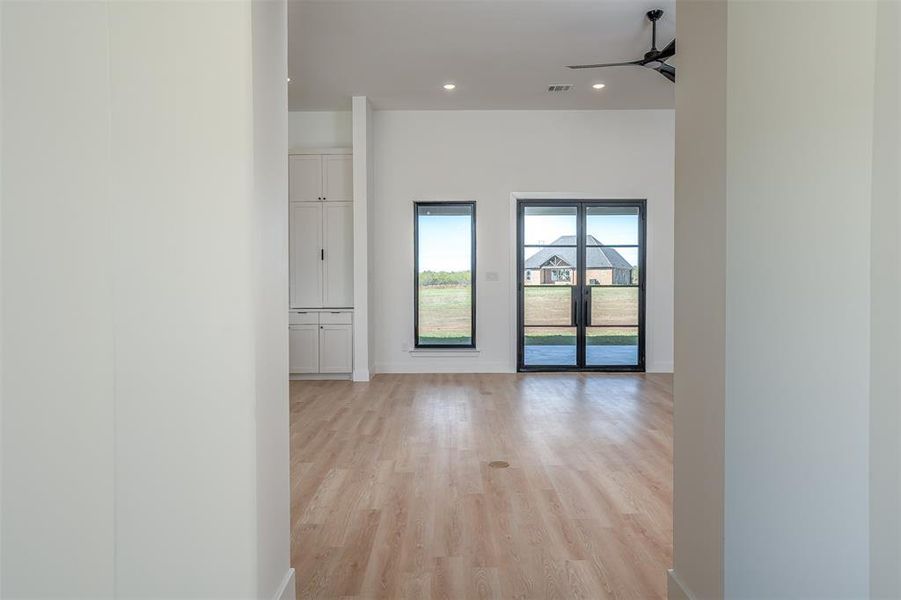 Corridor featuring light hardwood / wood-style flooring