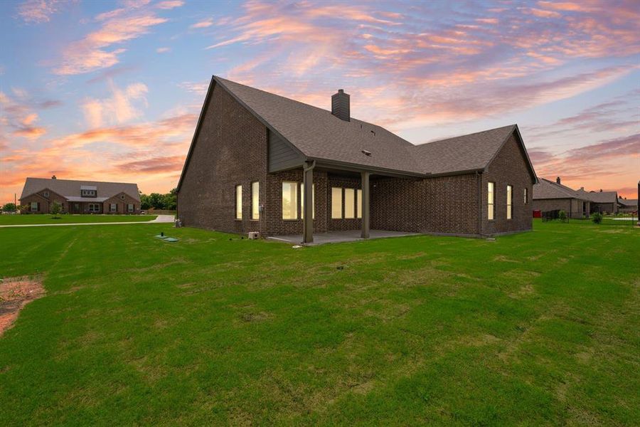 Front exterior of a new home in Fannin Ranch, Leonard, TX, highlighting curb appeal (Image 2). Front exterior of a new home in Fannin Ranch, Leonard, TX, highlighting curb appeal (Image 2).