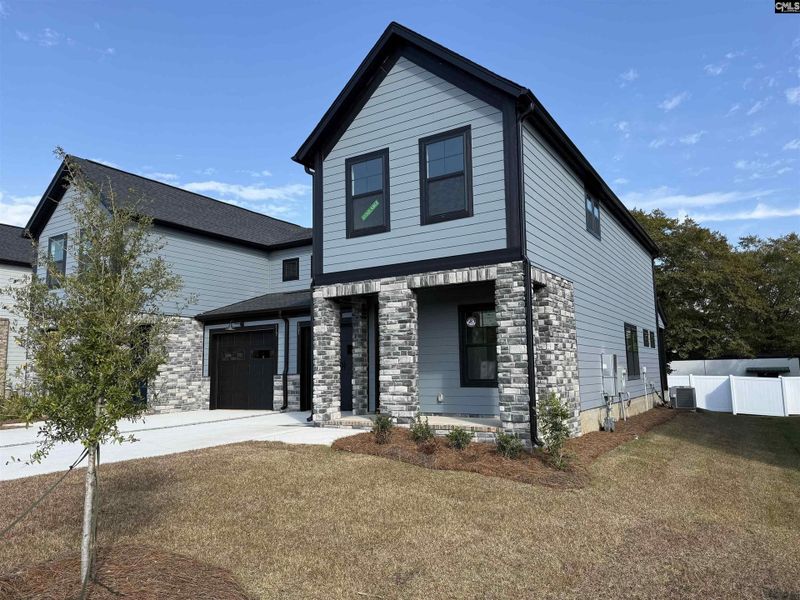 Front exterior of a new home in Dunbar Village, Cayce, SC, highlighting curb appeal (Image 1).