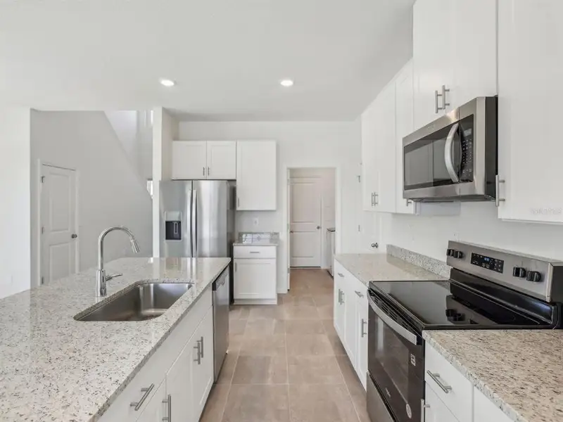 Furnished interior view inside a new home in Two Rivers - Premier Series, Zephyrhills (Image 5). Furnished interior view inside a new home in Two Rivers - Premier Series, Zephyrhills (Image 5).