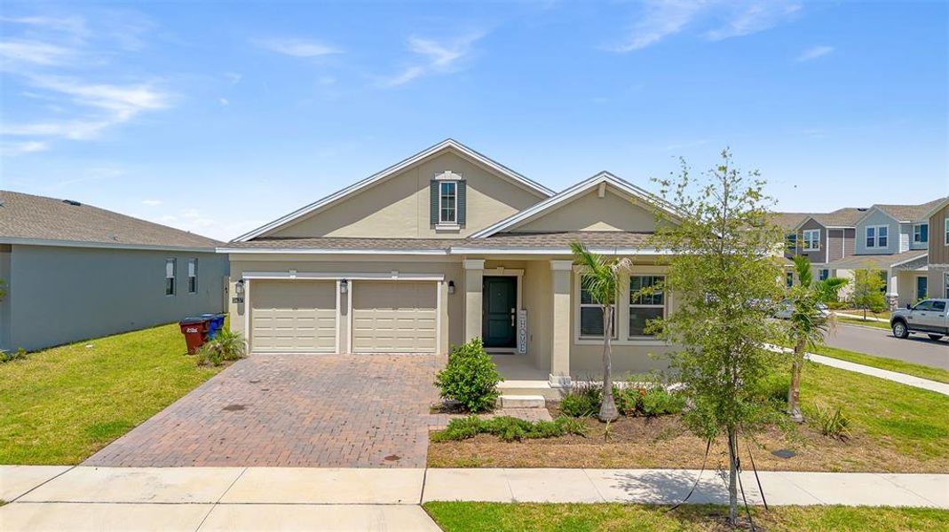 Front exterior of a new home in Tohoqua, Kissimmee, FL, highlighting curb appeal (Image 26). Front exterior of a new home in Tohoqua, Kissimmee, FL, highlighting curb appeal (Image 26).