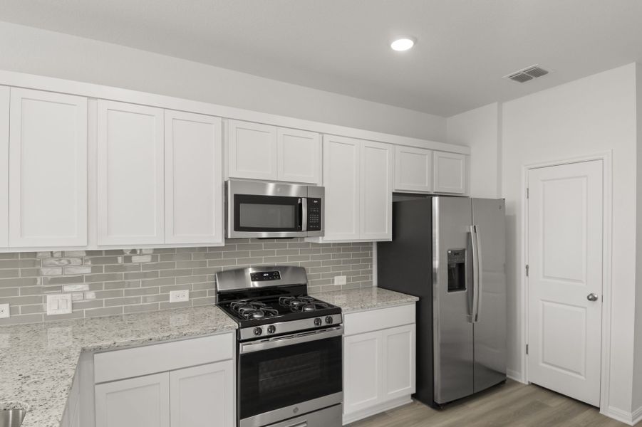 Furnished interior view inside a new home in Trace, San Marcos (Image 17).
