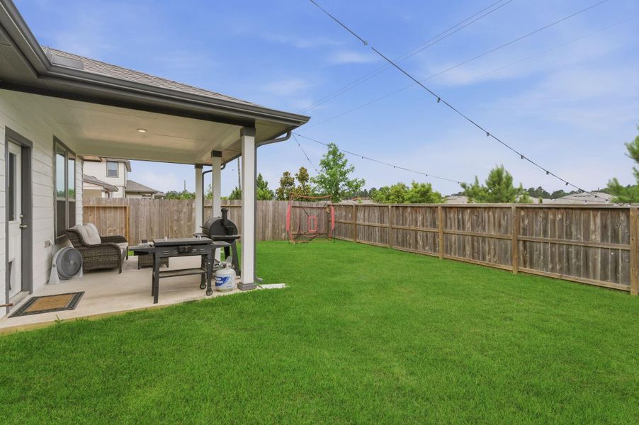 Spacious back patio perfect for entertaining and relaxing
