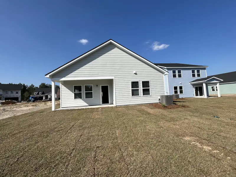 Exterior details and patio area of a home in , Ravenel (Image 13).