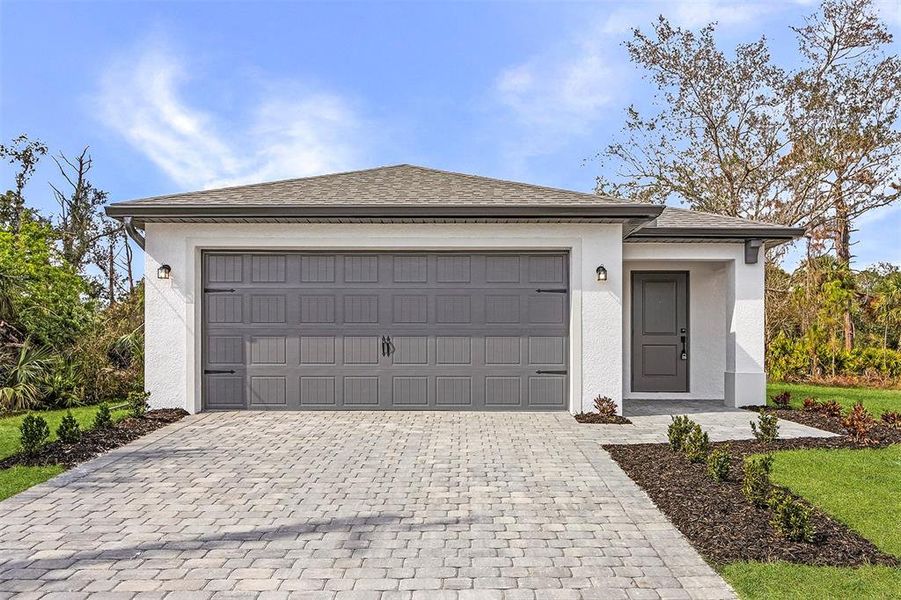 Front exterior of a new home in Port Charlotte, North Port, FL, highlighting curb appeal (Image 2).