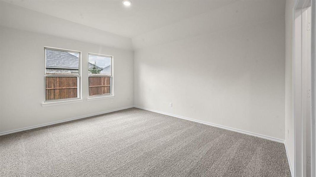 Empty room featuring carpet floors and recessed lighting