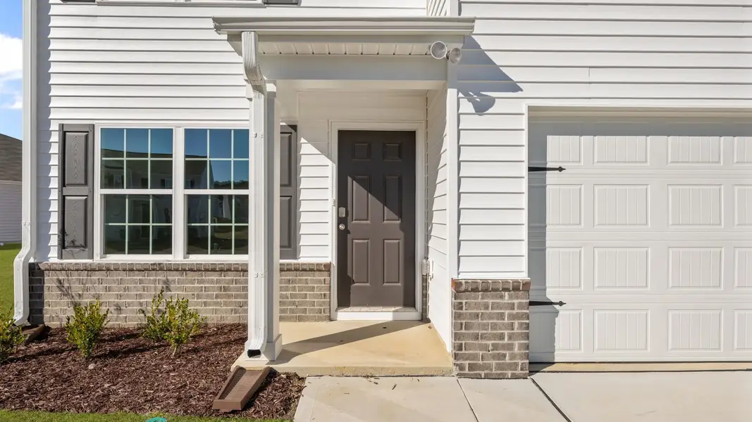 Exterior details and patio area of a home in Madeline Farm, New Bern (Image 3).