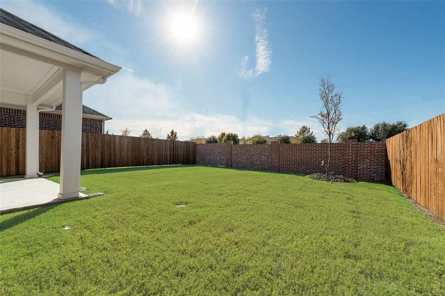 Exterior details and patio area of a home in Walden Pond, Forney (Image 21).