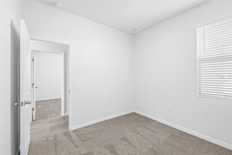 Spacious, unfurnished interior of a new home in The Grove at Stuart Crossing - Premier Series, Bartow (Image 24).