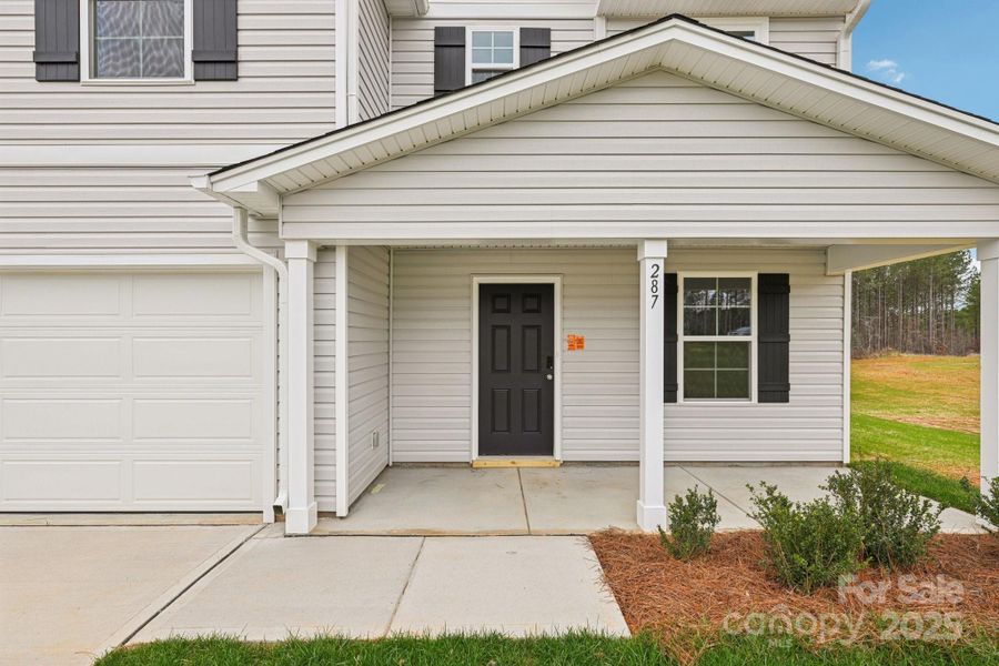 Exterior details and patio area of a home in The Pines at Stoney Point, Lexington (Image 12).