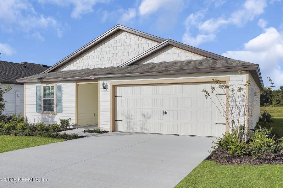 Front exterior of a new home in Rolling Hills, Green Cove Springs, FL, highlighting curb appeal (Image 2). Front exterior of a new home in Rolling Hills, Green Cove Springs, FL, highlighting curb appeal (Image 2).