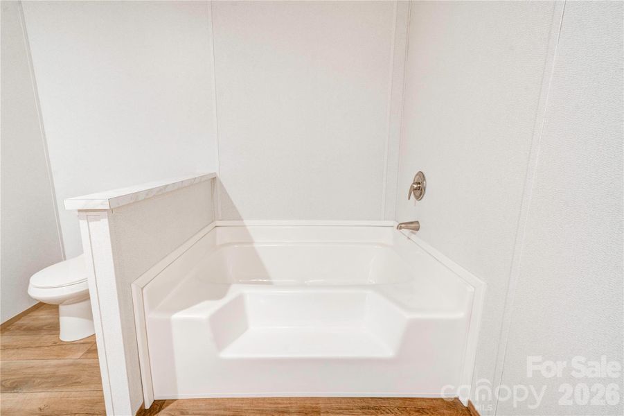 Primary Bath has a soaking tub.