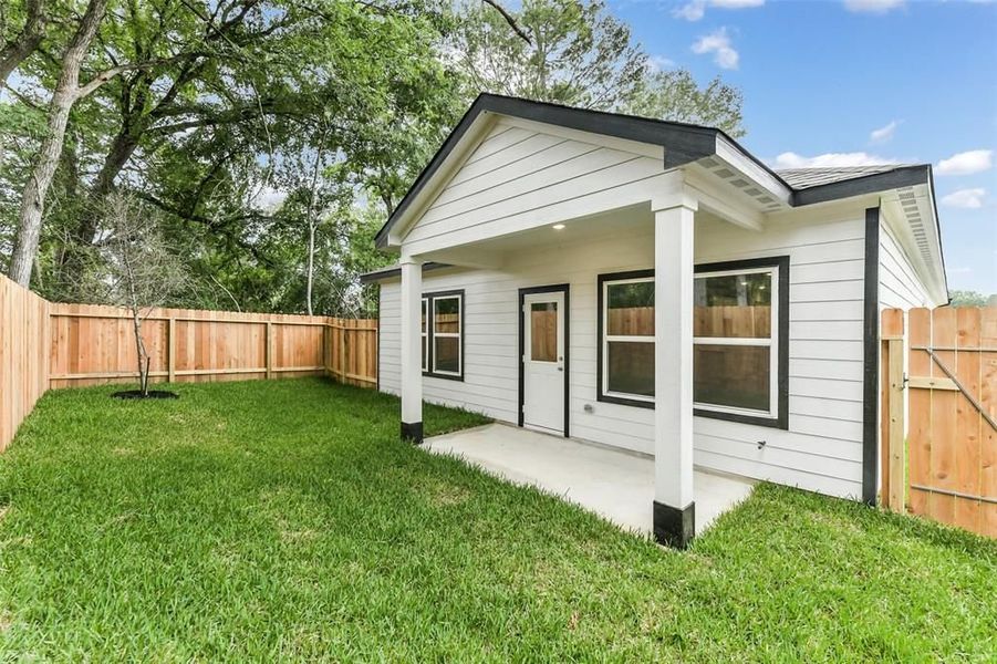 Front exterior of a new home in Caney Creek Place, Conroe, TX, highlighting curb appeal (Image 56).