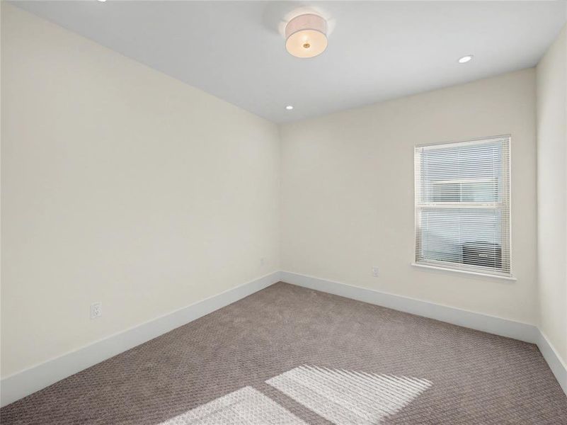 Unfurnished room with carpet flooring and recessed lighting