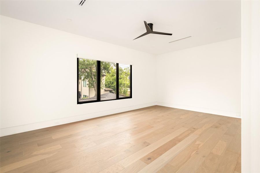 Well-sized secondary bedroom with large window and abundant natural light.